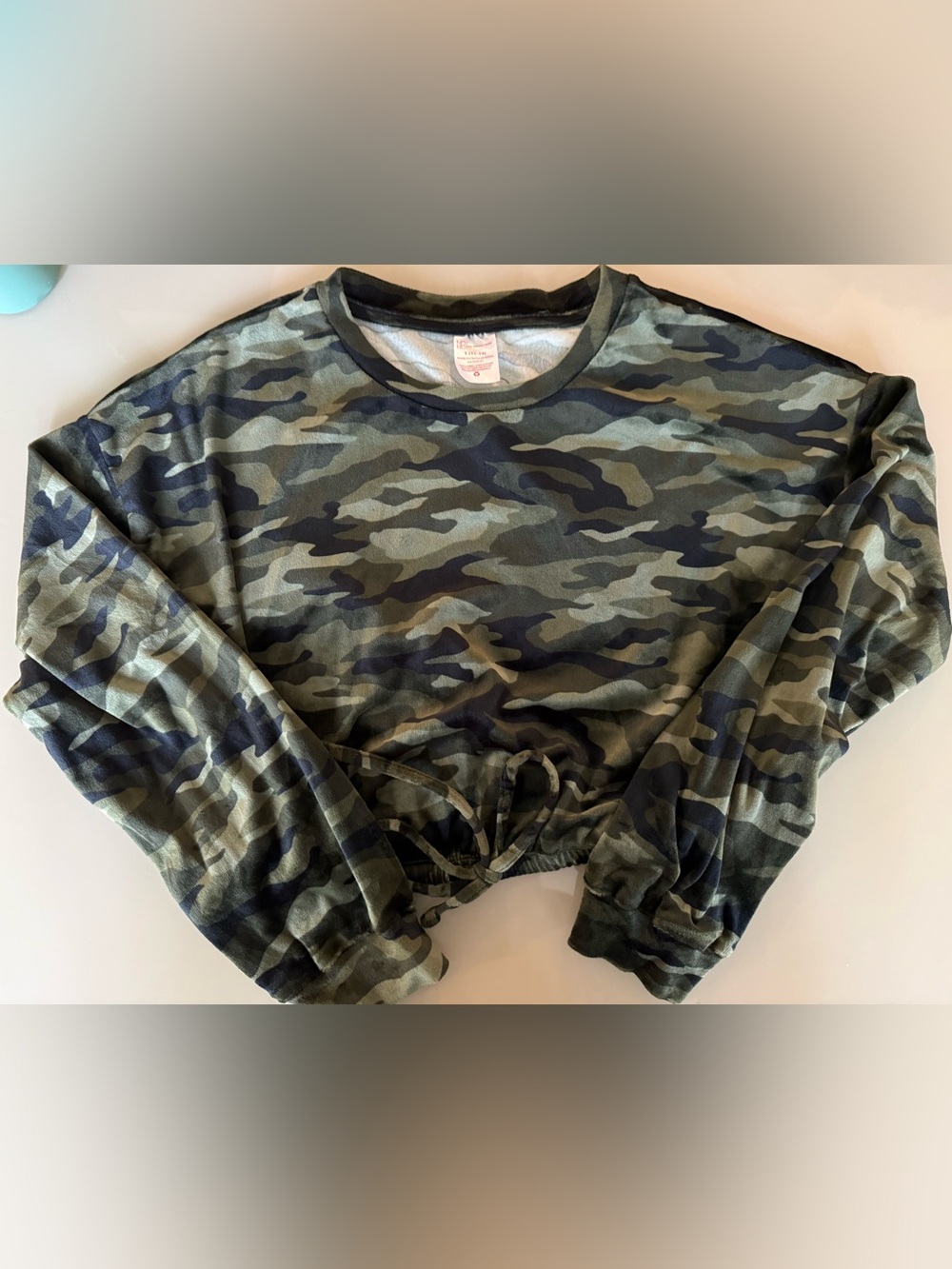 Women’s Soft Velour Camo Drawstring Cropped Sweatshirt with matching pants.